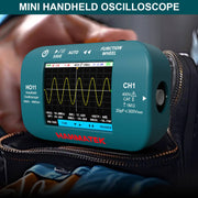 HANMATEK® HO11 Handheld Oscilloscope displaying waveform signals in a carrying bag.