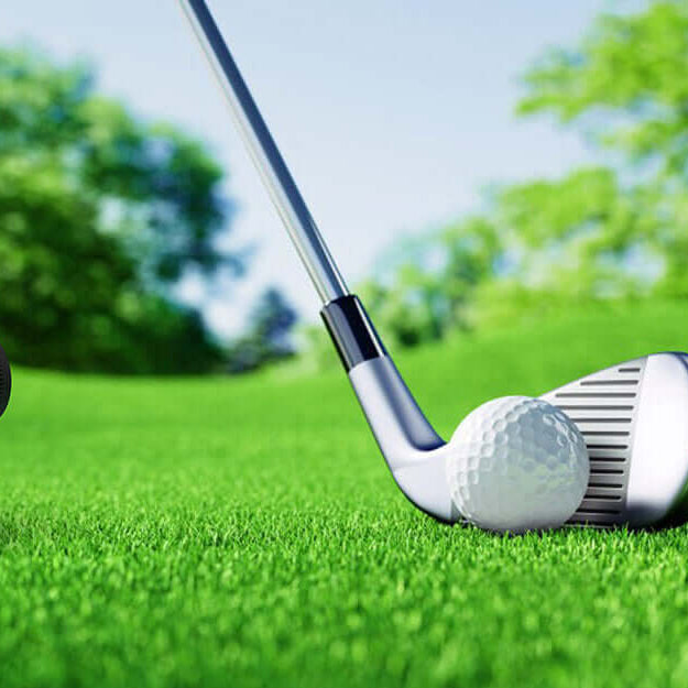 Golf rangefinder and club on green grass with golf ball, outdoor measurement tool
