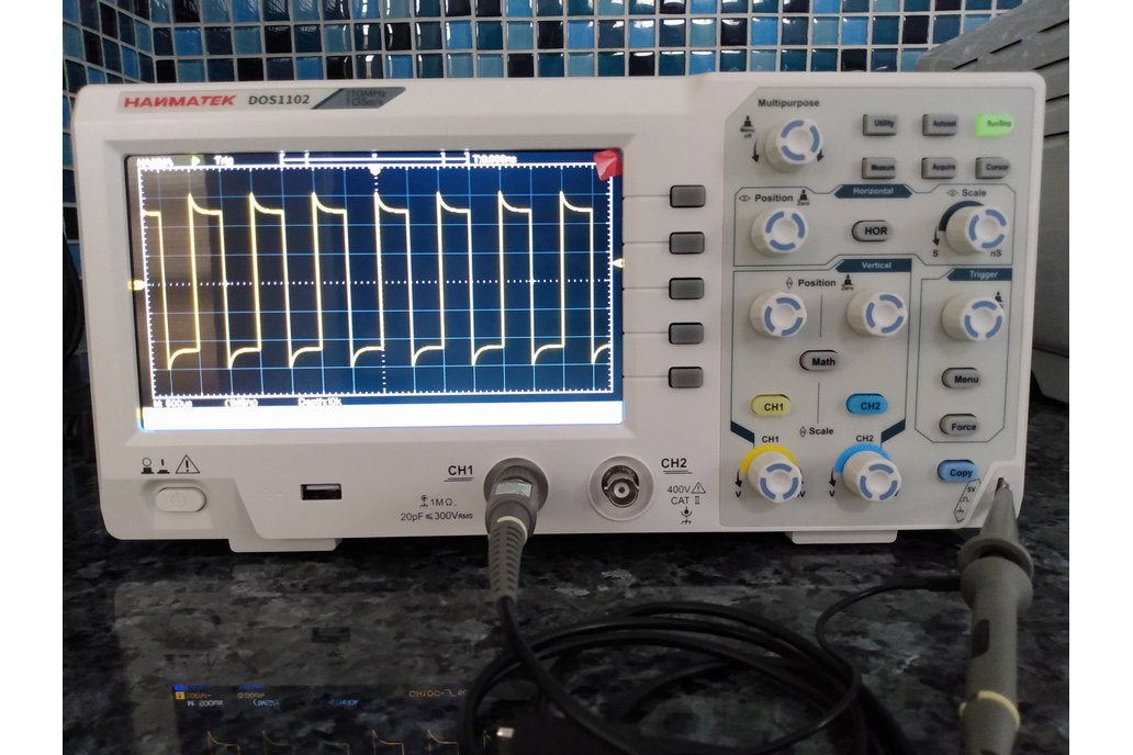 Hantek DOS1102 Oscilloscope displaying waveforms, showcasing its features for professionals in electronics.