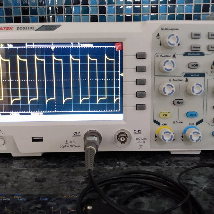 Hantek DOS1102 Oscilloscope displaying waveforms, showcasing its features for professionals in electronics.