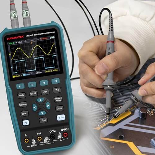 Handheld digital oscilloscope with probes testing a circuit board, measurement display visible