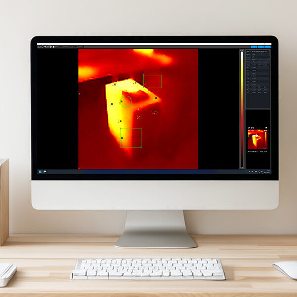 Thermal Imaging Camera displayed next to a computer showing thermal analysis software for electrical inspection.