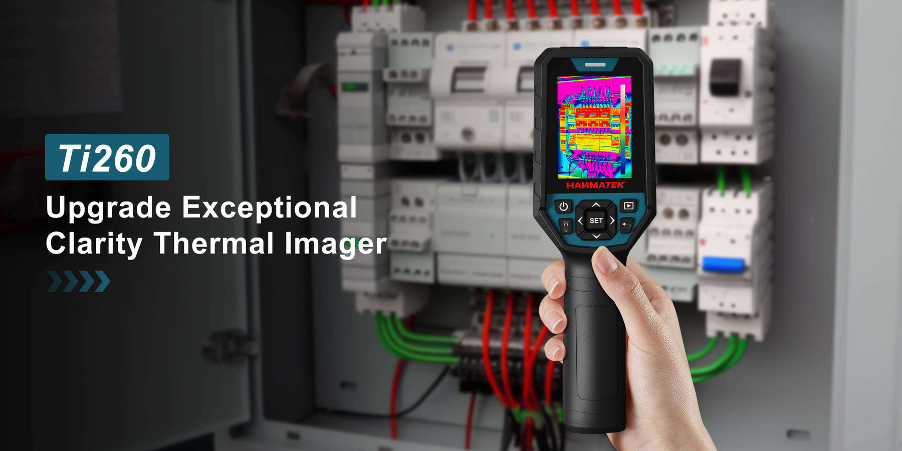 Hand holding Ti260 thermal imager scanning electrical panel for temperature measurement