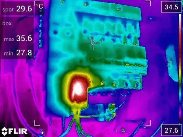 Thermal Camera image showing infrared heat mapping of an electrical component with temperature readings.