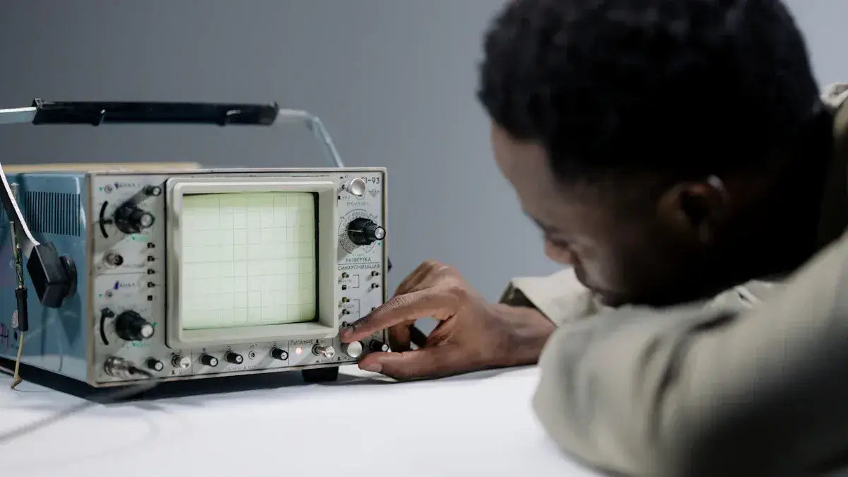 Person adjusting controls on analog oscilloscope, test and measurement instrument