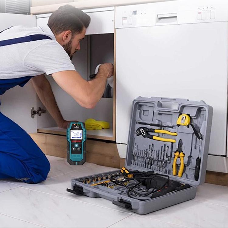Professional using a wall scanner for professionals to detect wires and pipes under a sink during installation