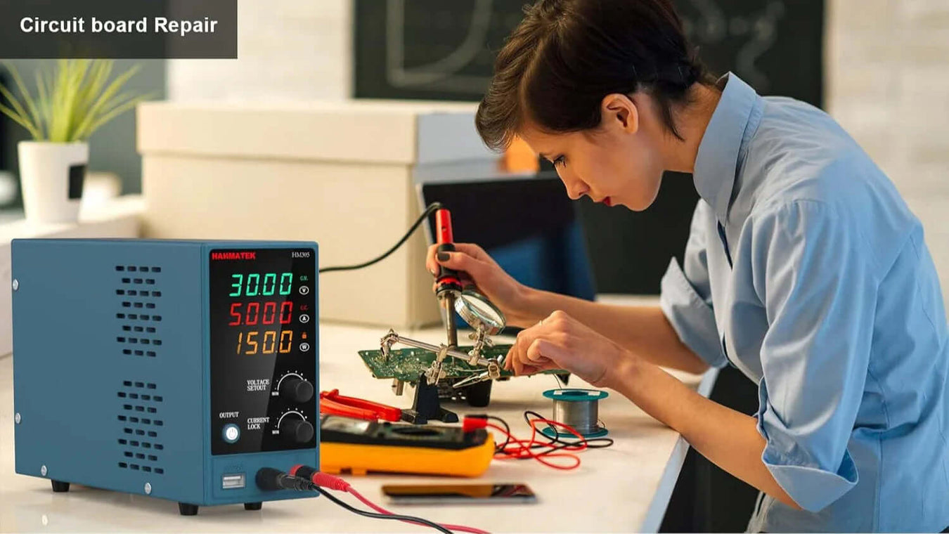 HANMATEK HM Series DC power supply for electronics in a lab setting for circuit board repair and testing