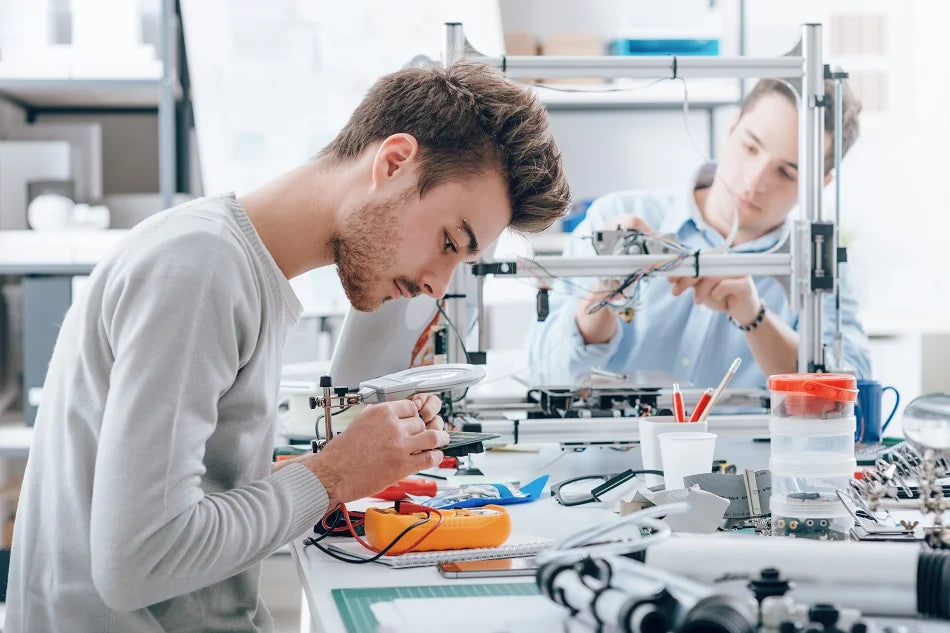 Two people working on a project in a laboratory setting
