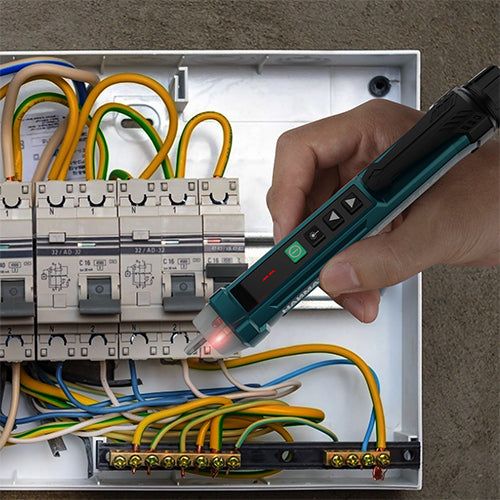 HANMATEK® AC voltage tester pen used for checking electrical connections in a control panel